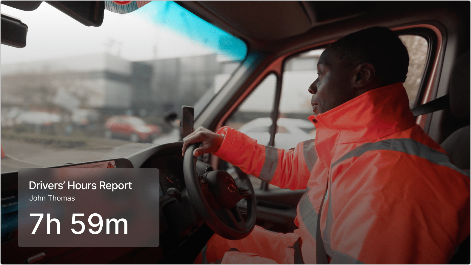 Driver in bright orange safety jacket operating a vehicle, with a digital hours report showing 7h 59m on screen.