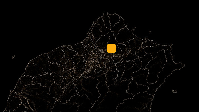 Dark map outline of a region with orange road networks and a bright orange square marking a central location.