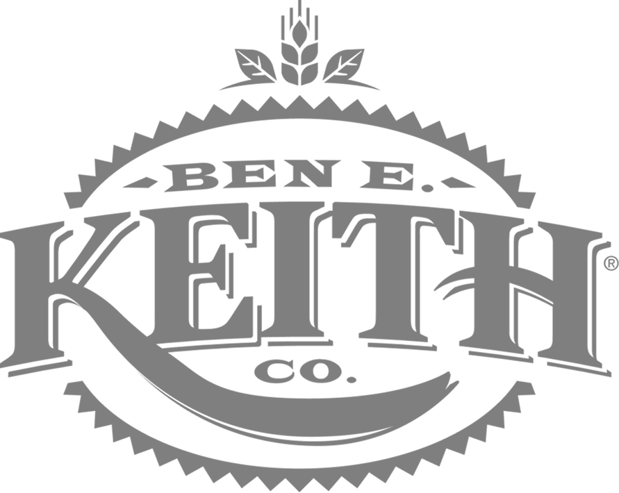 Gray circular badge logo for Ben E. Keith Co. with serrated edges and a wheat stalk emblem on top.
