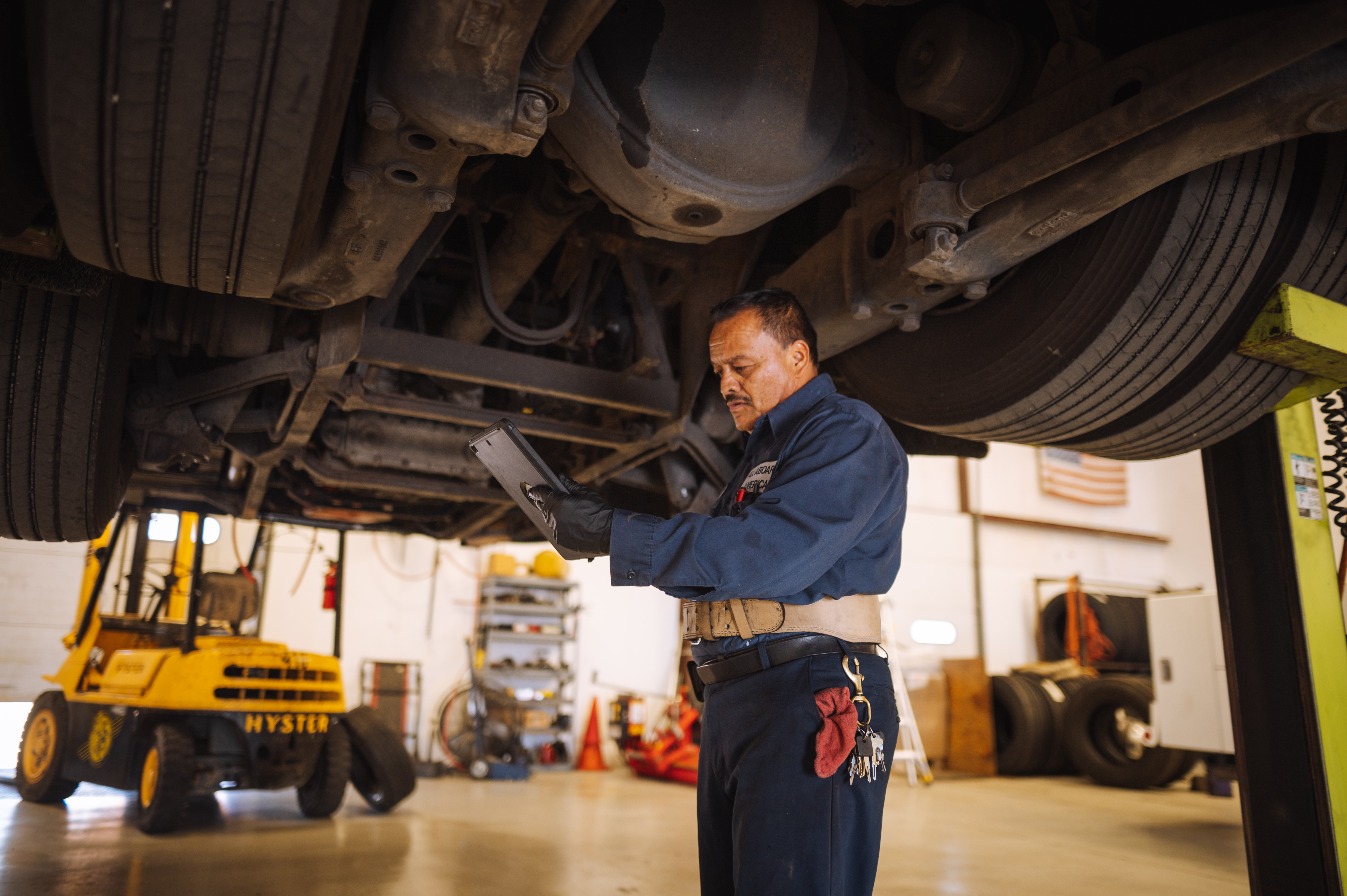 Maintenance team member inspecting vehicle 