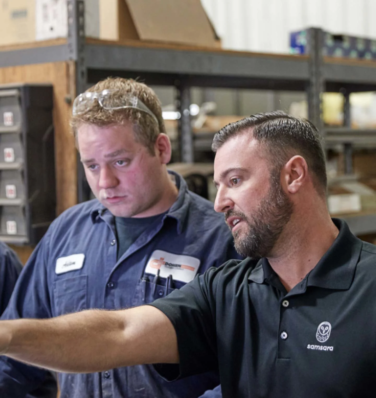person pointing windshield