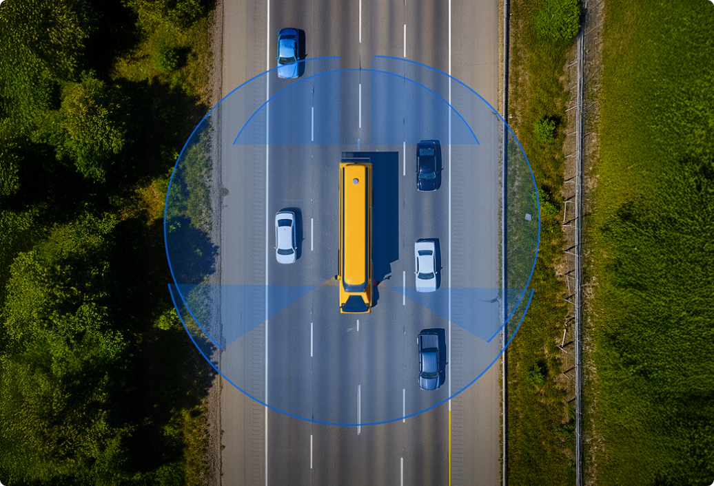 Aerial view of highway with yellow bus and cars, surrounded by blue circular sensor or detection zone.