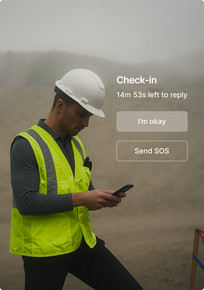 Construction worker in safety vest and hard hat checking phone with safety check-in notification overlay in foggy setting.