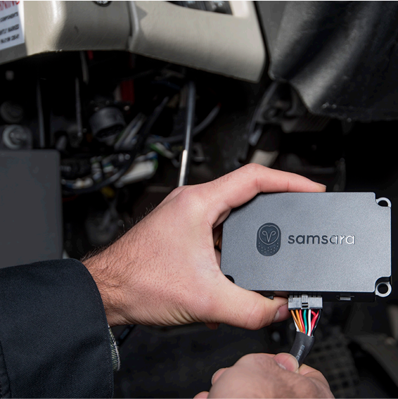 Person installing a Samsara device ELD technology