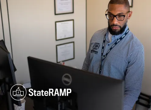 Government safety manager working on computer 