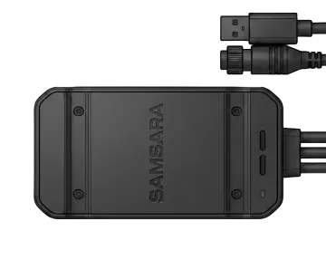 Black Samsara device with USB and connector cables attached, shown on white background.