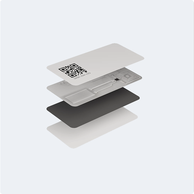 View of a tracking label showing three layers: a QR code top layer, NFC chip middle layer, and dark base layer.