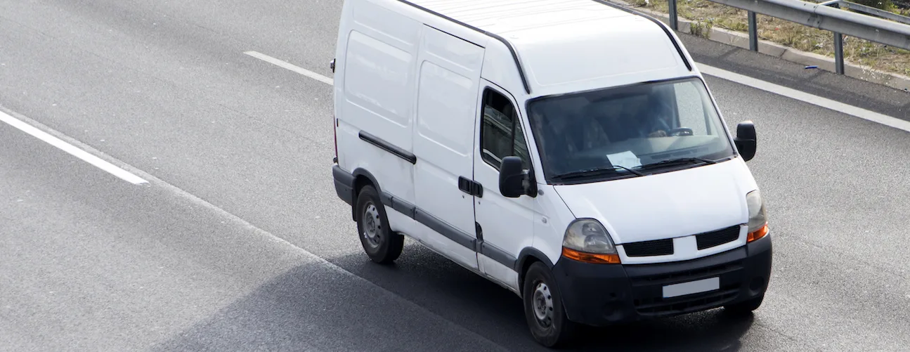 Truck on a road. On one side says trip completed and below a dual camera recording