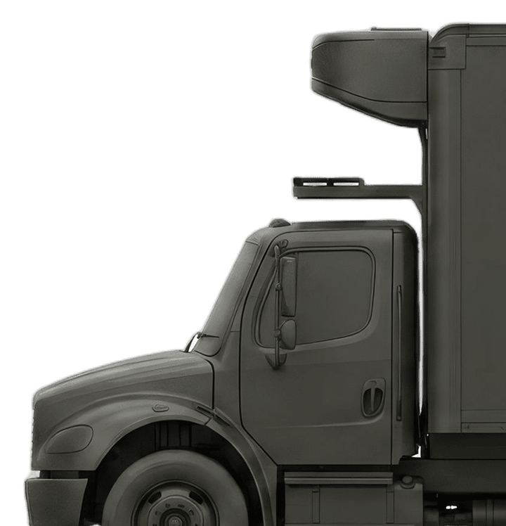 Side view of a dark gray commercial semi-truck cab with a rooftop air deflector on a white background.