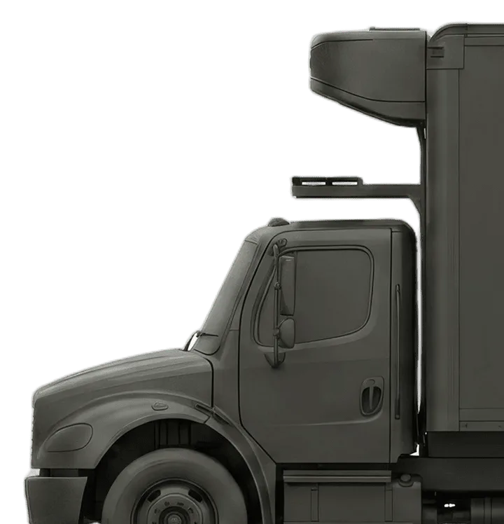 Side view of a dark gray commercial semi-truck cab with a rooftop air deflector on a white background.