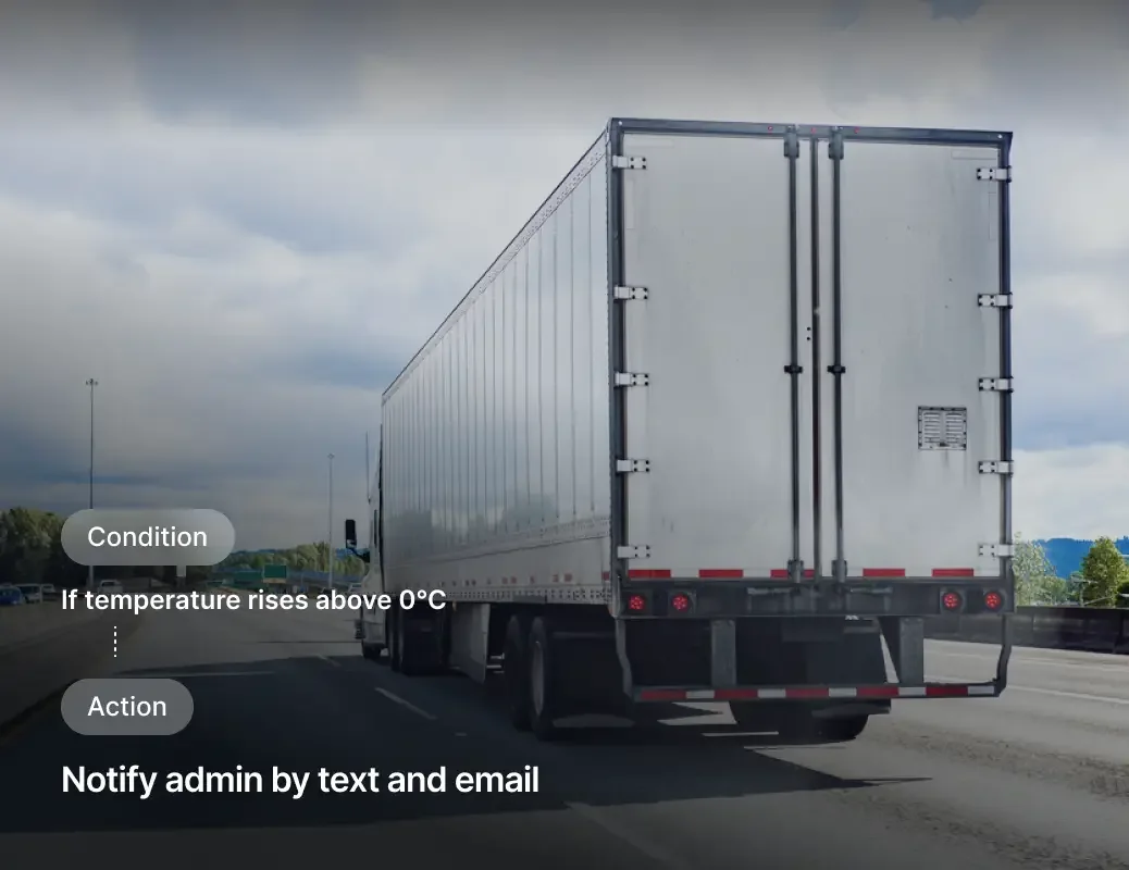 White semi truck trailer on highway with temperature alert interface showing condition and action notifications.