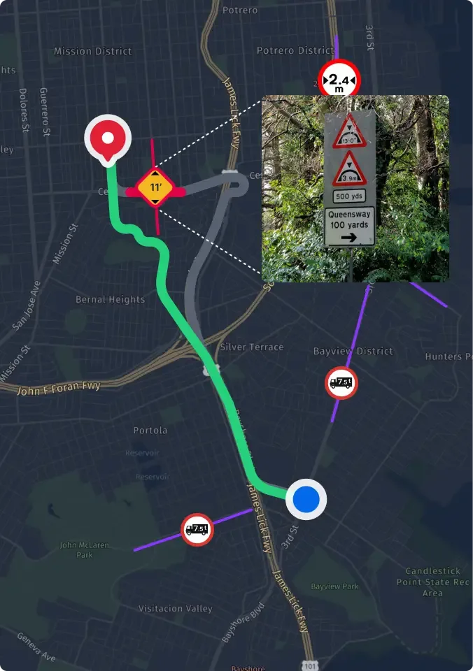 Speed limit 45 sign on roadside with commercial buildings in background, viewed from vehicle with side mirror visible.