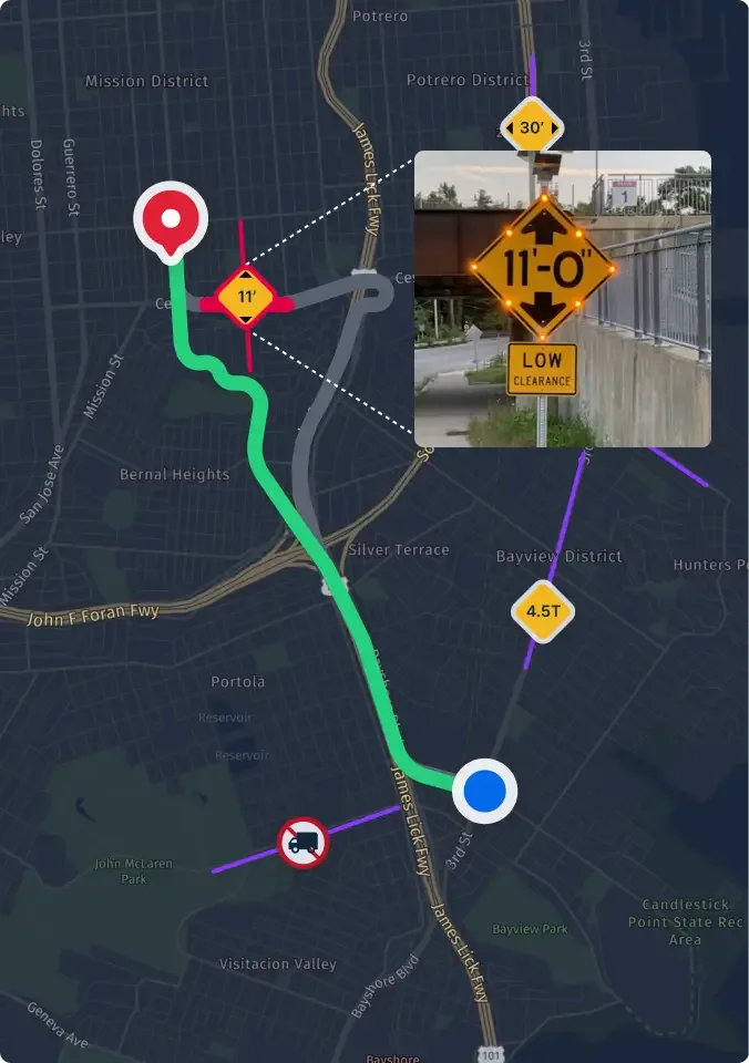 Speed limit 45 sign on roadside with commercial buildings in background, viewed from vehicle with side mirror visible.