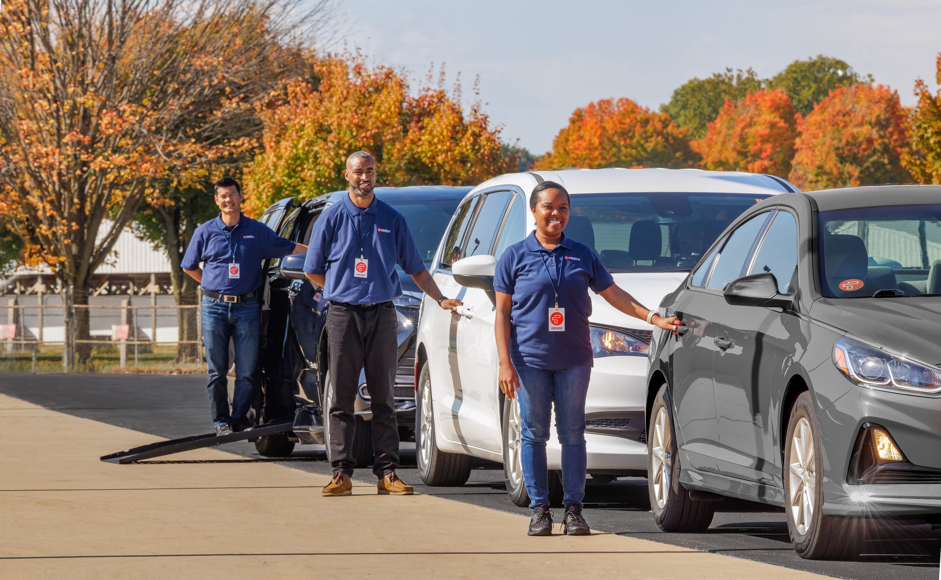 Drivers standing by vehicles