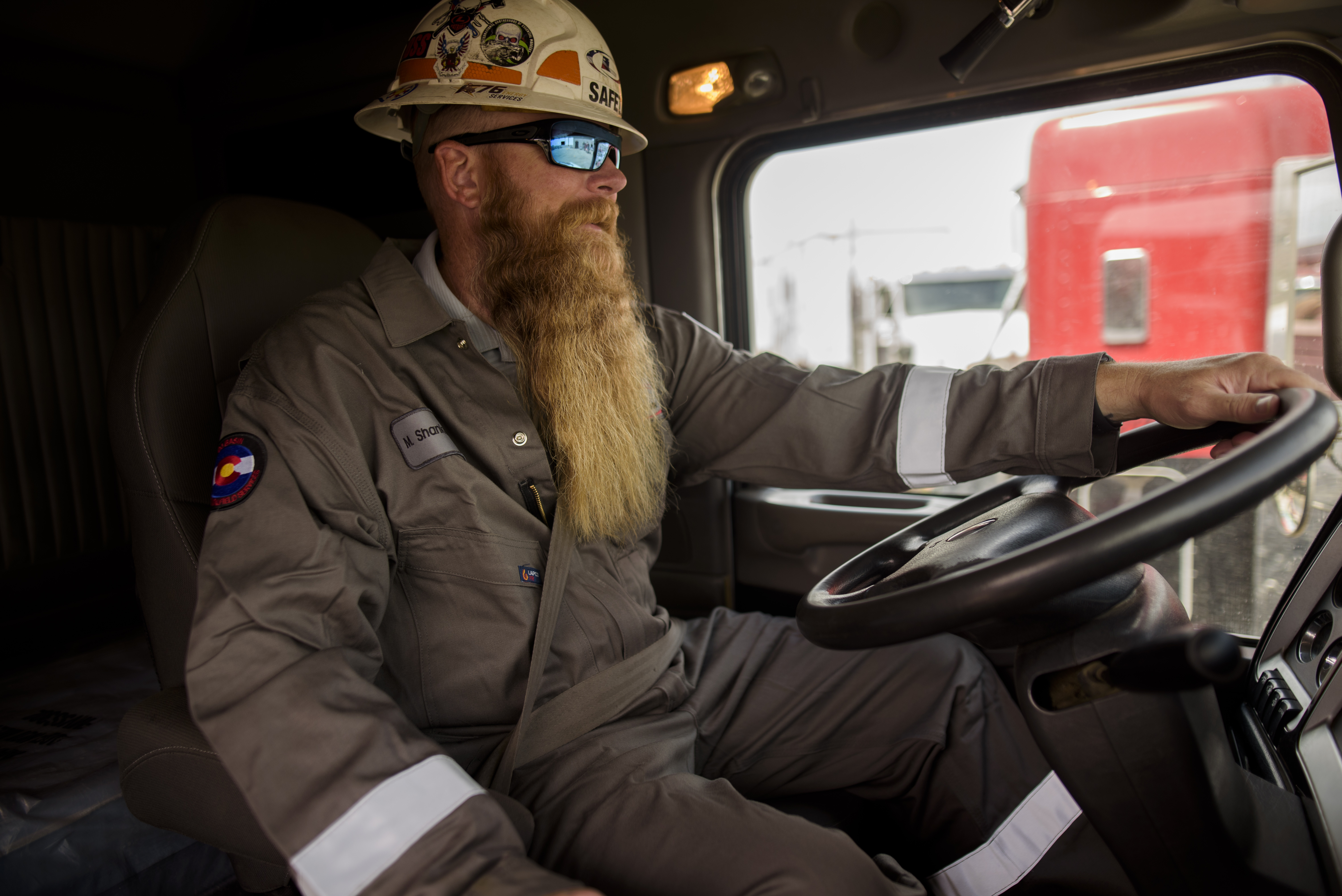 Driver behind truck steering wheel