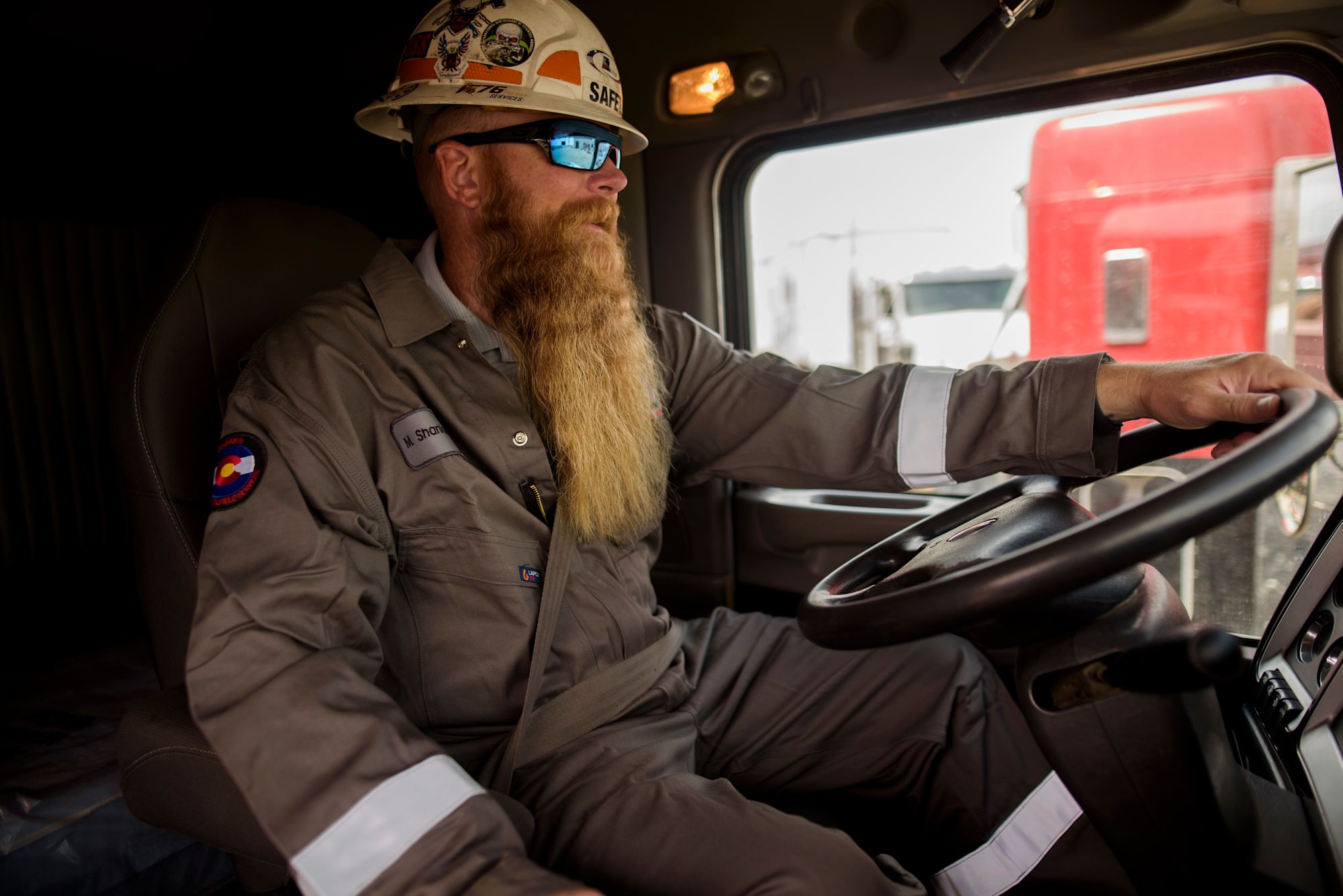 Driver behind truck steering wheel