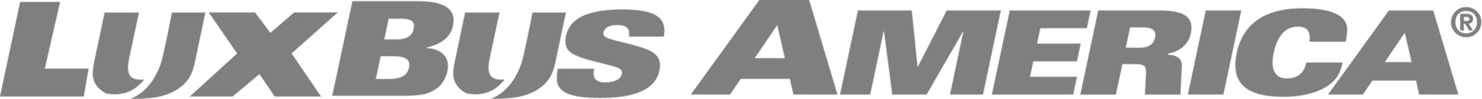 LuxBus America logo in bold gray italic letters with a registered trademark symbol.