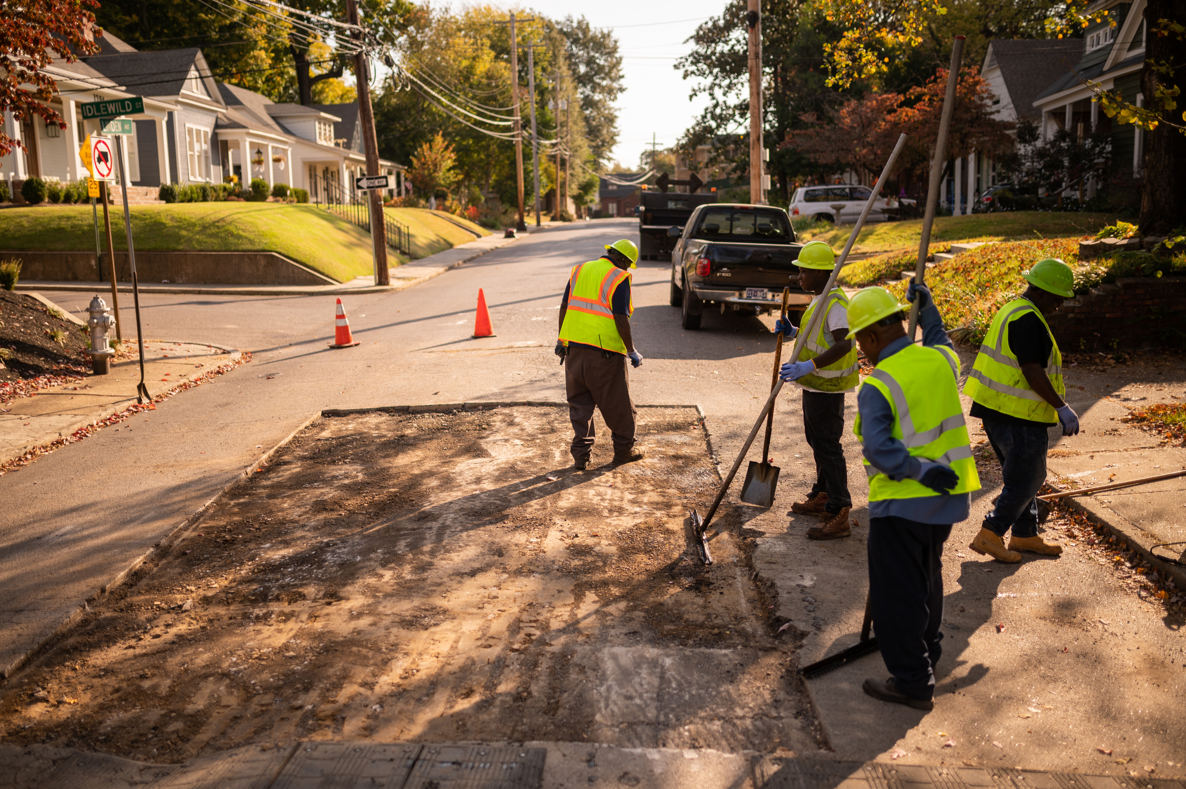 Public works crew repairing a residential street