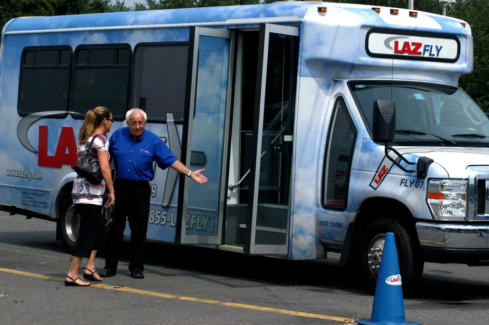 Bus driver welcoming passenger