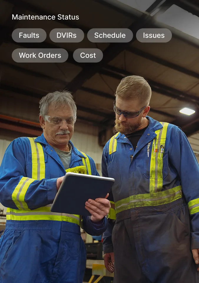 Mechanic reviews upcoming scheduled maintenance for vehicle on tablet, including image of flat tyre that needs to be changed.