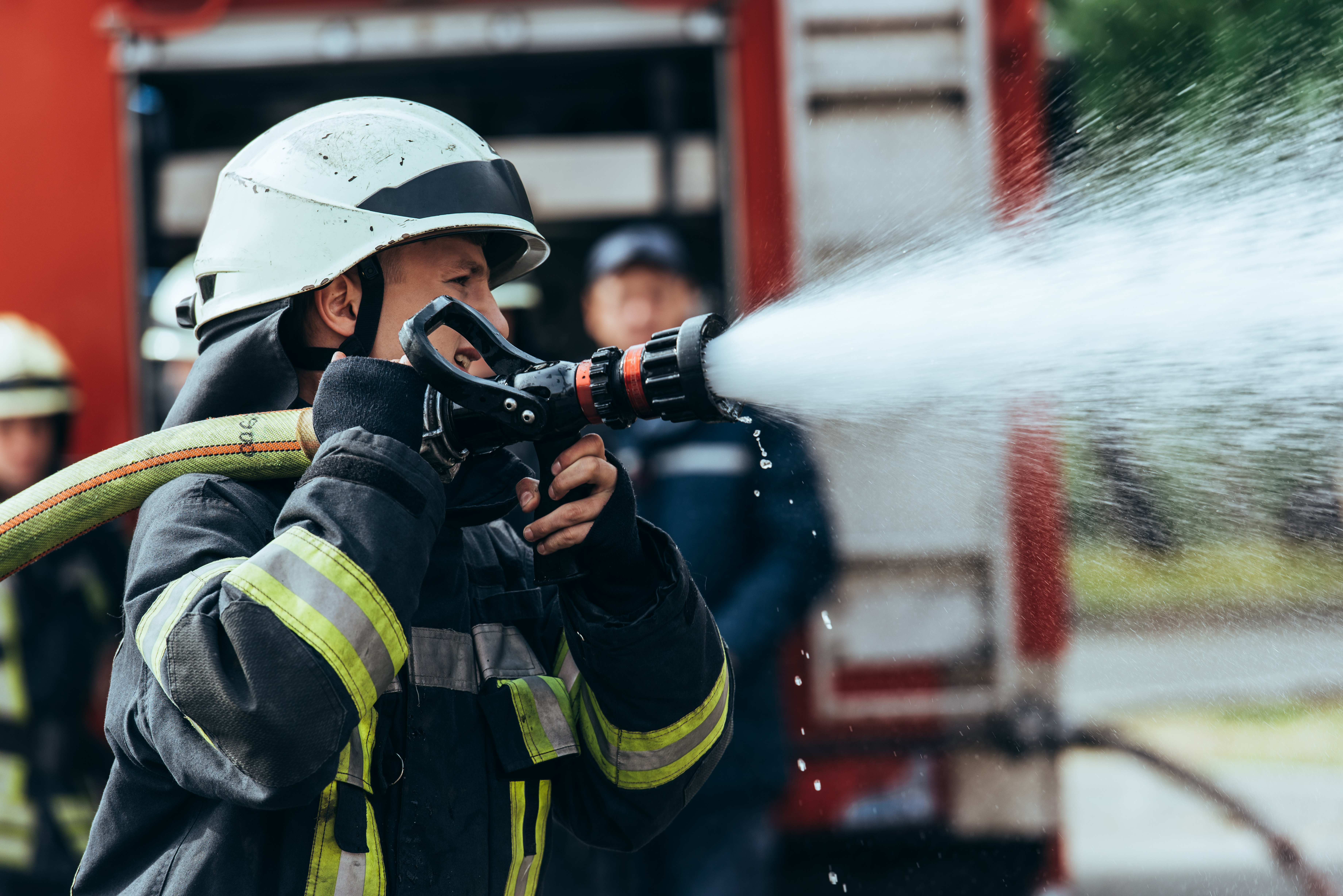 Firefighters with hose
