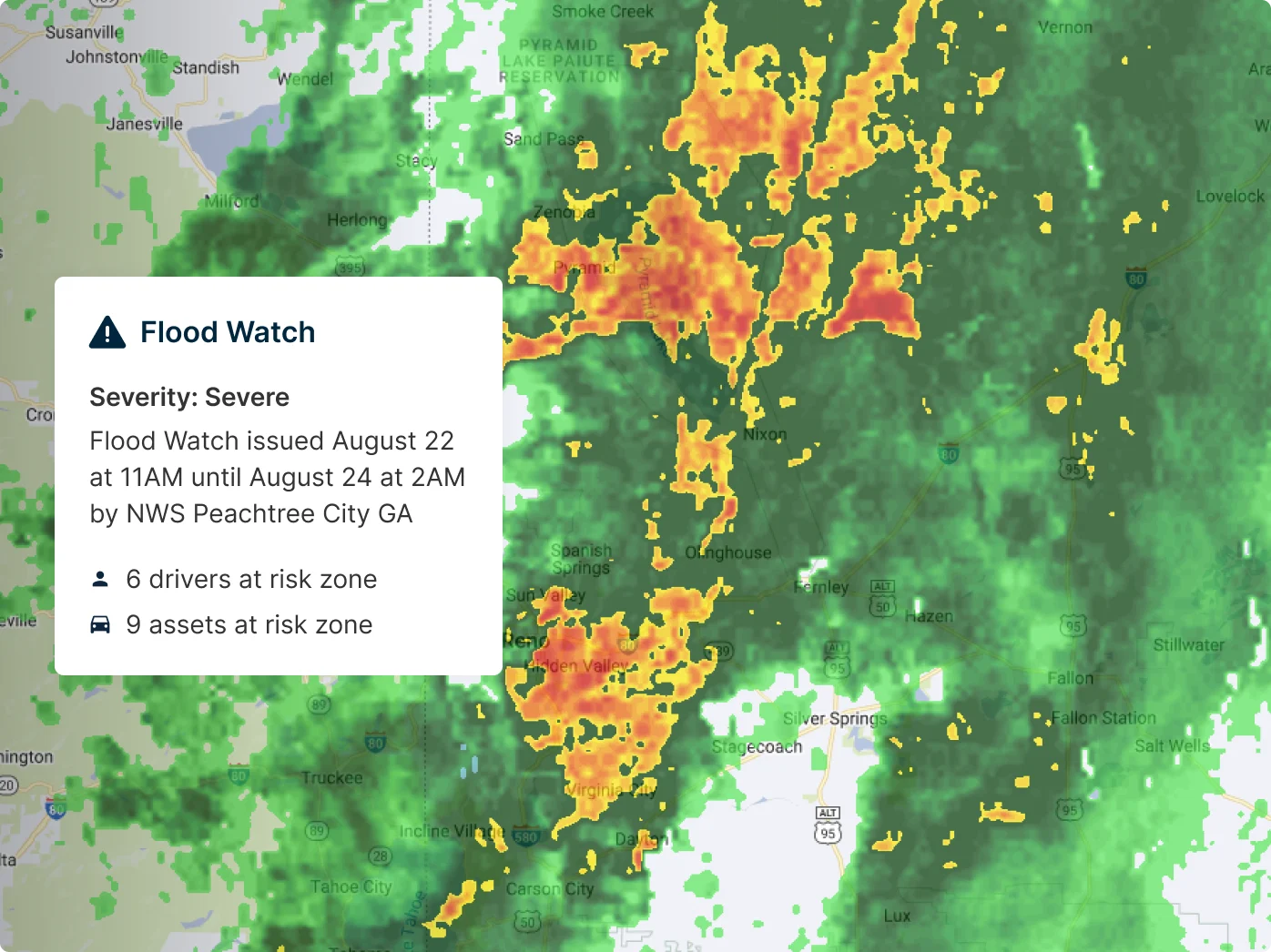 Weather radar map showing severe flood watch alert with orange, red precipitation areas, affecting 6 drivers 9 assets at risk
