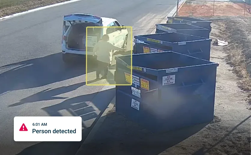 Split-screen dashboard view of a vehicle, showing driver in safety vest and forward-facing cameras.