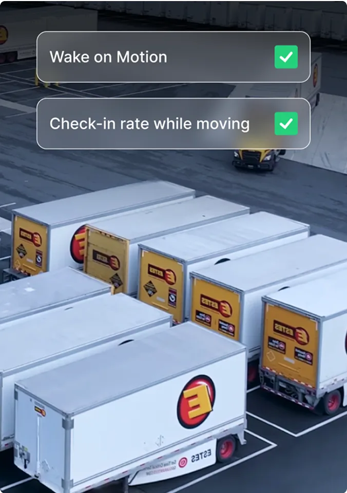Delivery trucks in parking lot w/mobile app showing "Wake on Motion" and "Check-in rate while moving" options enabled.