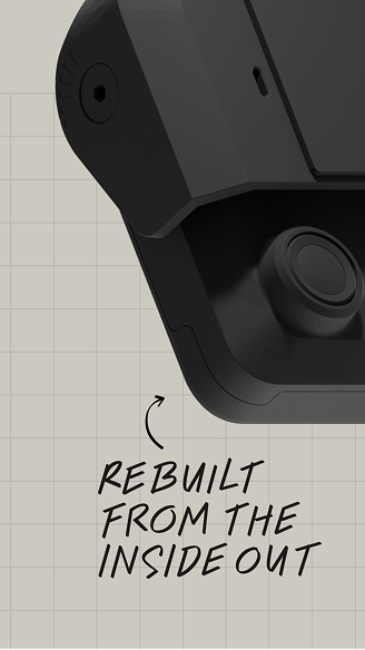 Close-up of a black security camera on a grid background with text reading Rebuilt From The Inside Out.