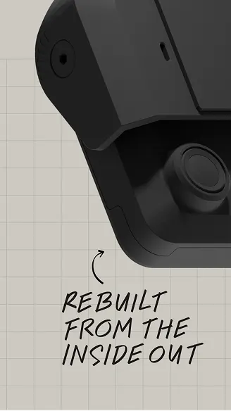 Close-up of a black security camera on a grid background with text reading Rebuilt From The Inside Out.