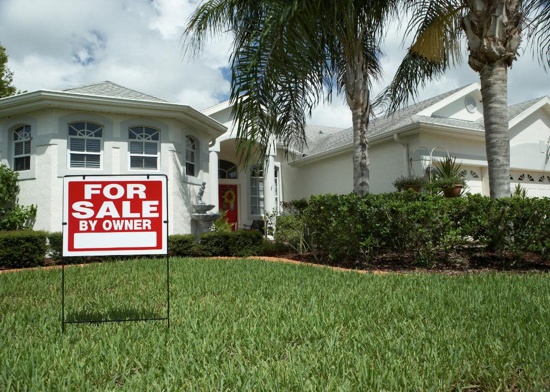  “Low-angle photograph of a ‘For Sale’ sign in the lawn of a home” - Source: Canva