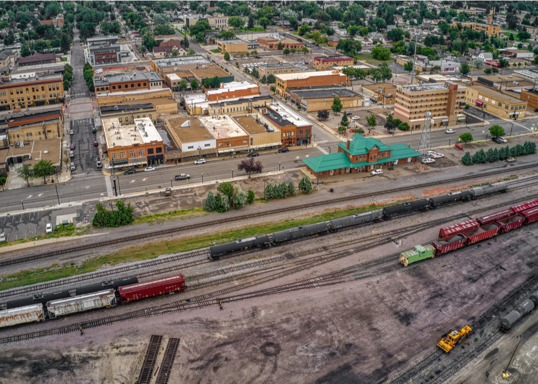 “High-angle photograph of a business district adjoining a trainyard” -Source: Jacob Boomsma // Shutterstock
