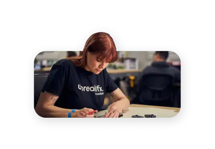 Expert repairing a device at a uBreakiFix by Asurion store.