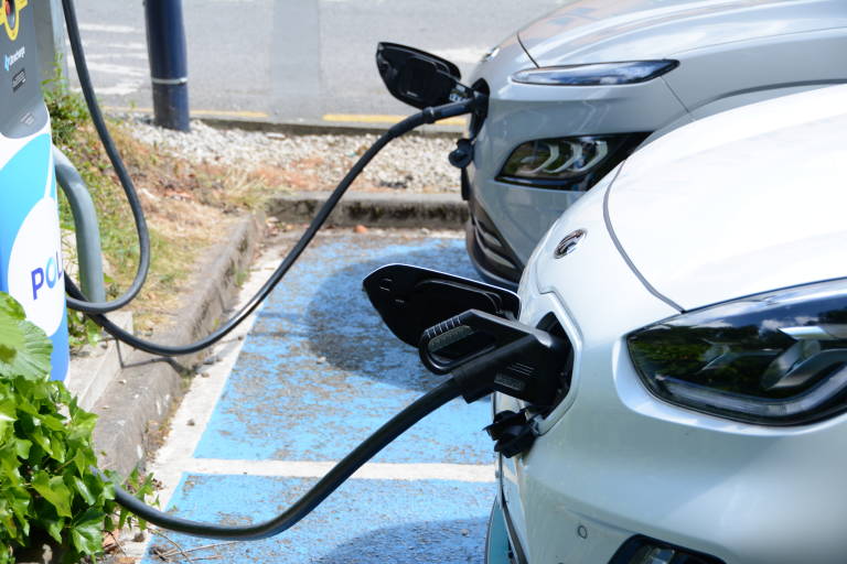 Two electric vehicles charging