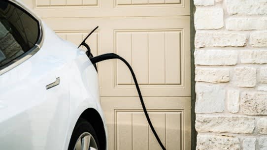 Electric car being charged at home