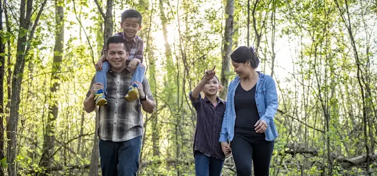 Family walking on trail