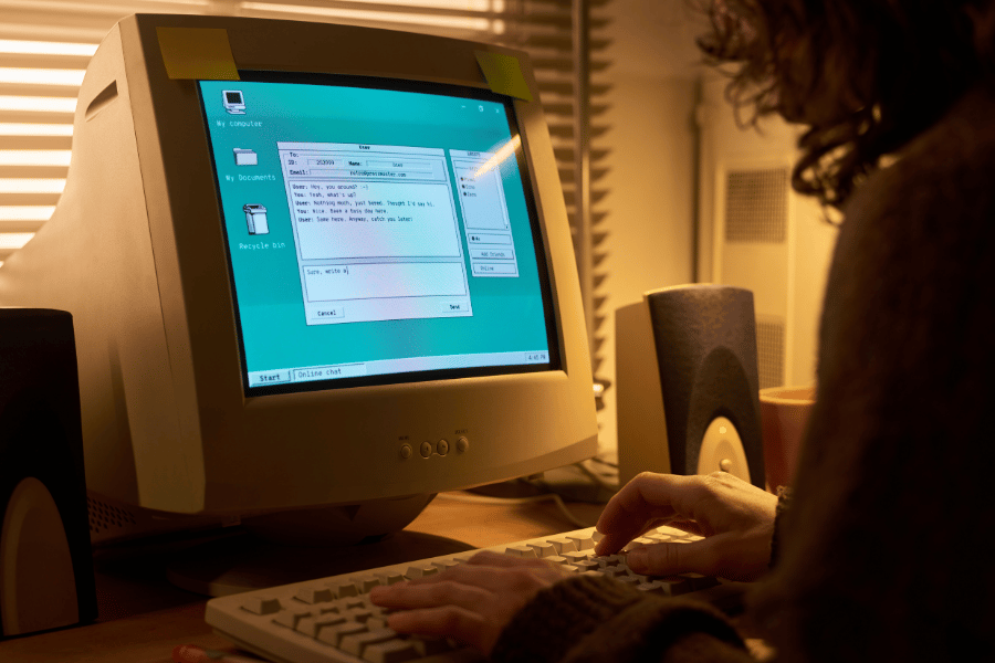 Old-fashioned computer woman typing on keyboard