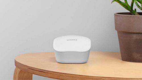 eero mesh wifi booster on table in home