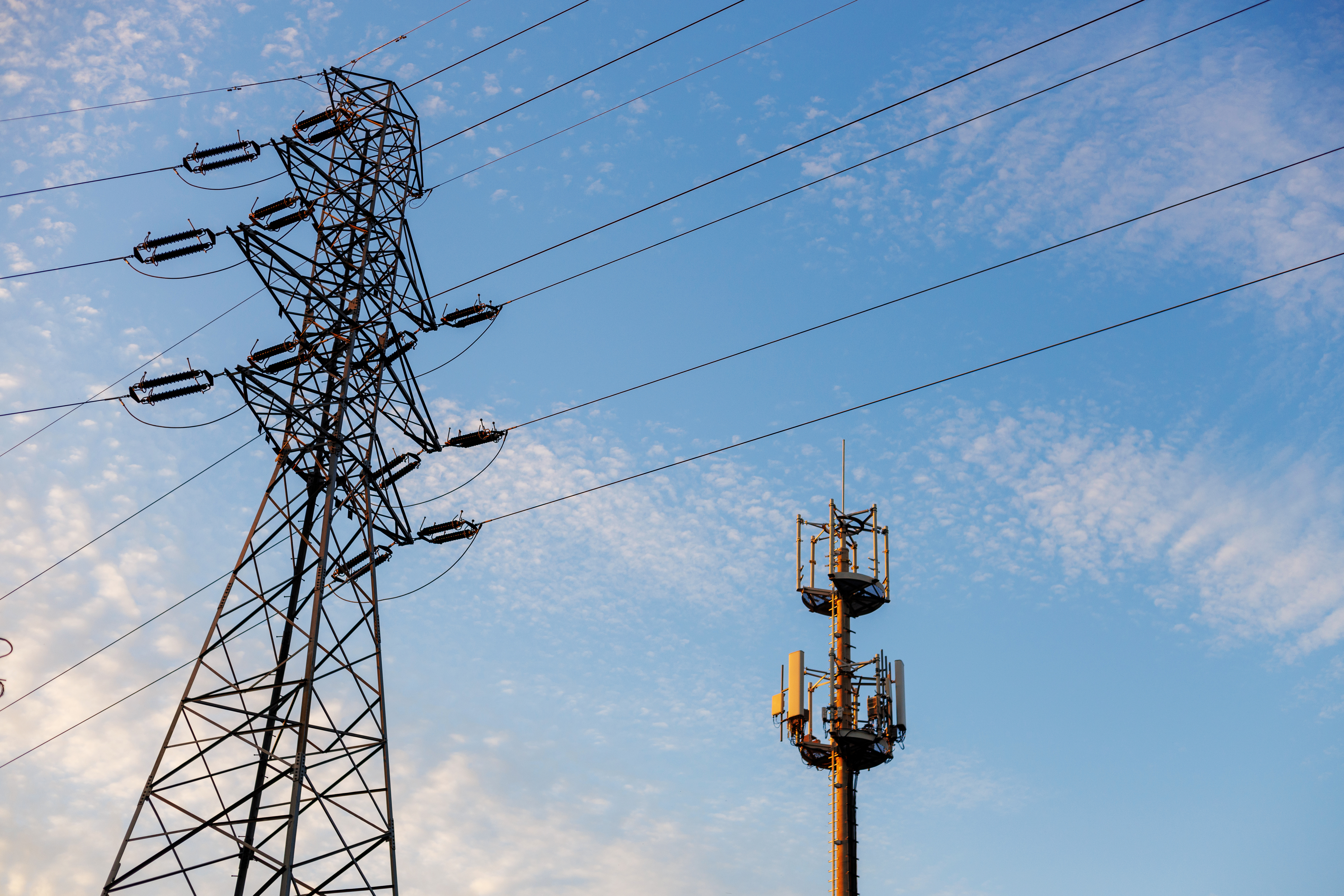 A telephone mast against blue sky