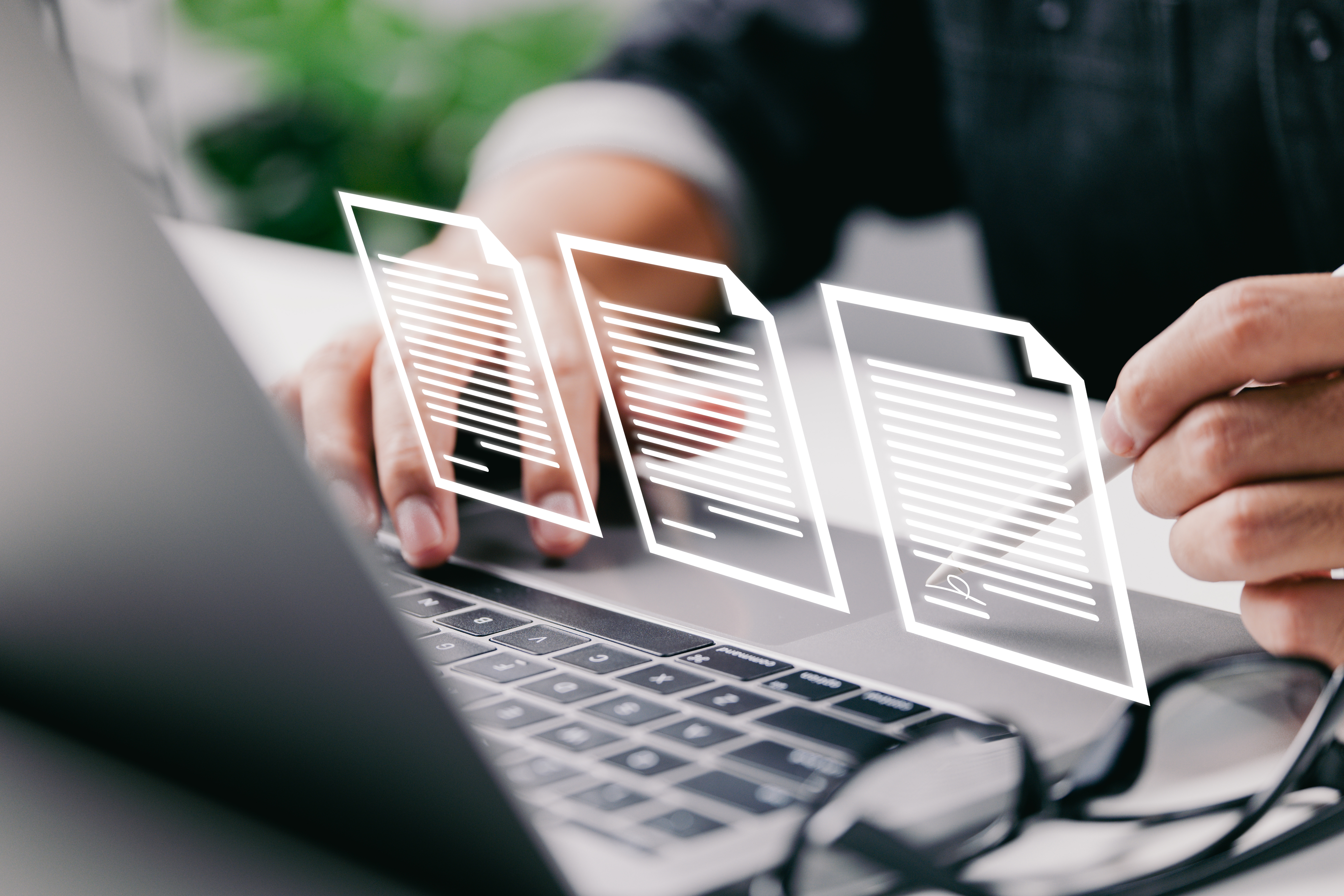 Man using laptop showing contract document reading
