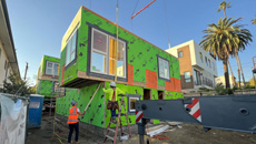 Installation of modular multifamily fourplex building