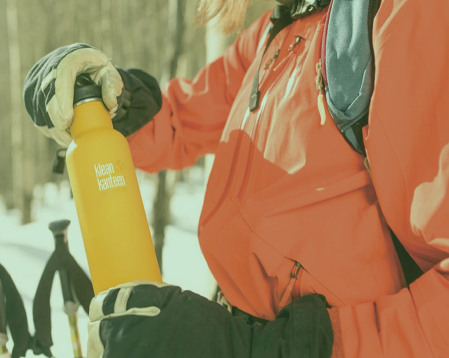 Person outdoors holding water bottle