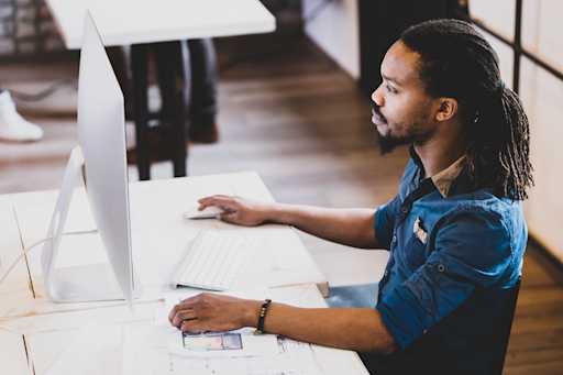 freelance coder typing javascript code on computer to... Your Career Path | 84.51°