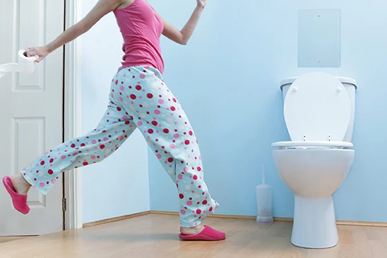 Woman running to the bathroom because of urination frequency