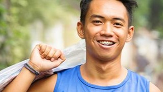 man smiling with braces