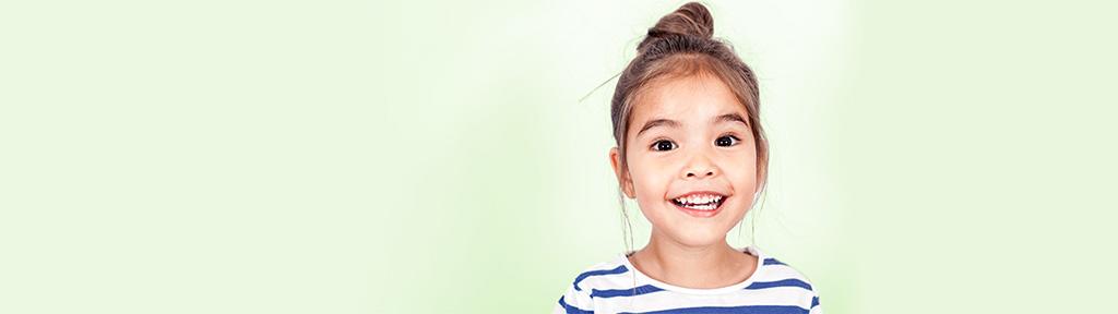 little girl with a striped shirt smiling