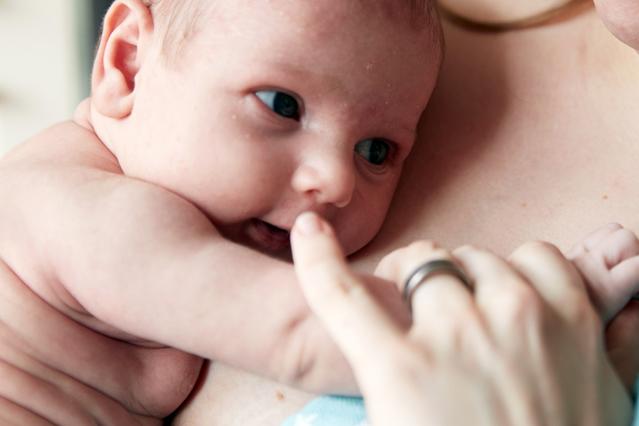 Mother preparing for breastfeeding baby