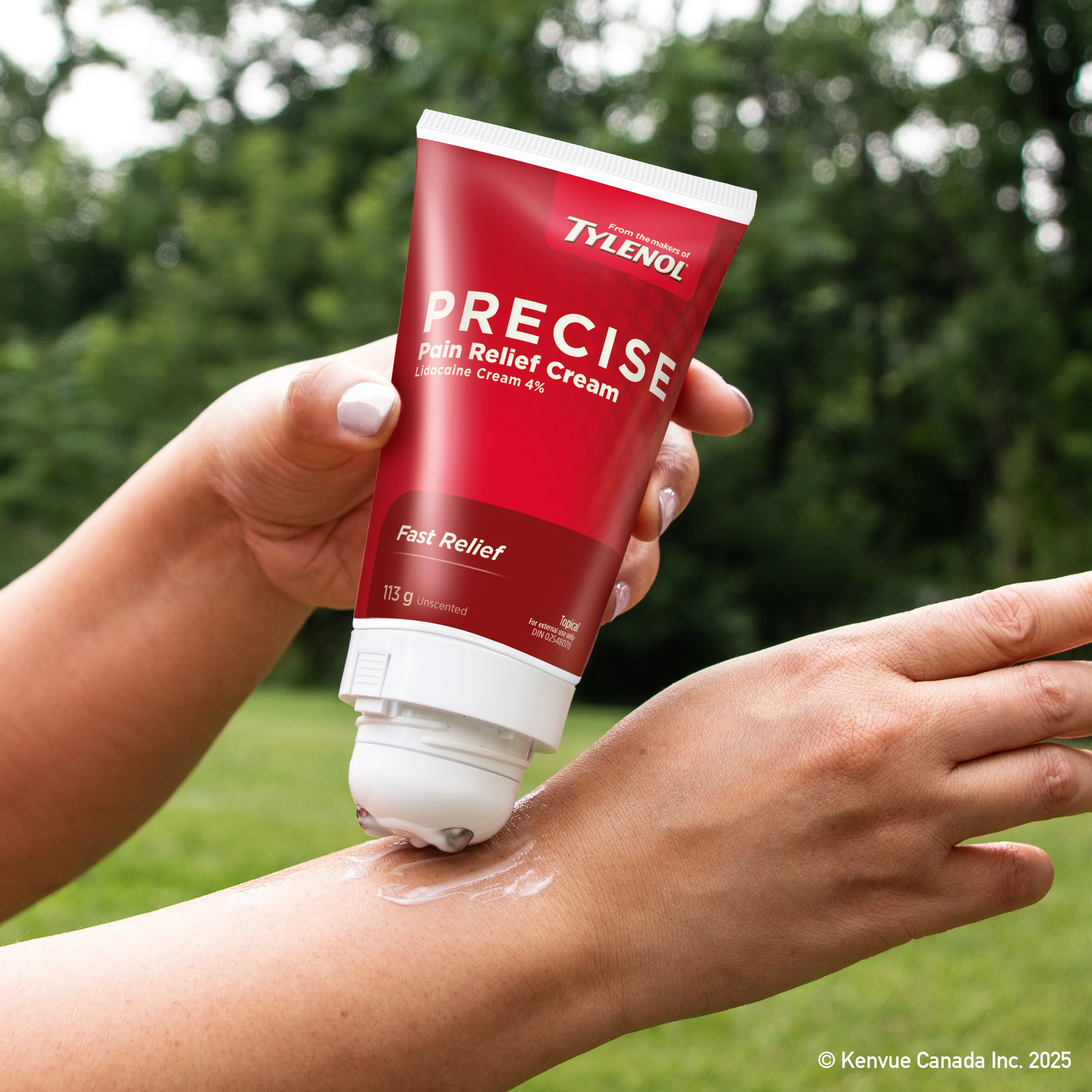 Person applying Precise Pain Relief Cream From the makers of TYLENOL to their wrist for pain relief