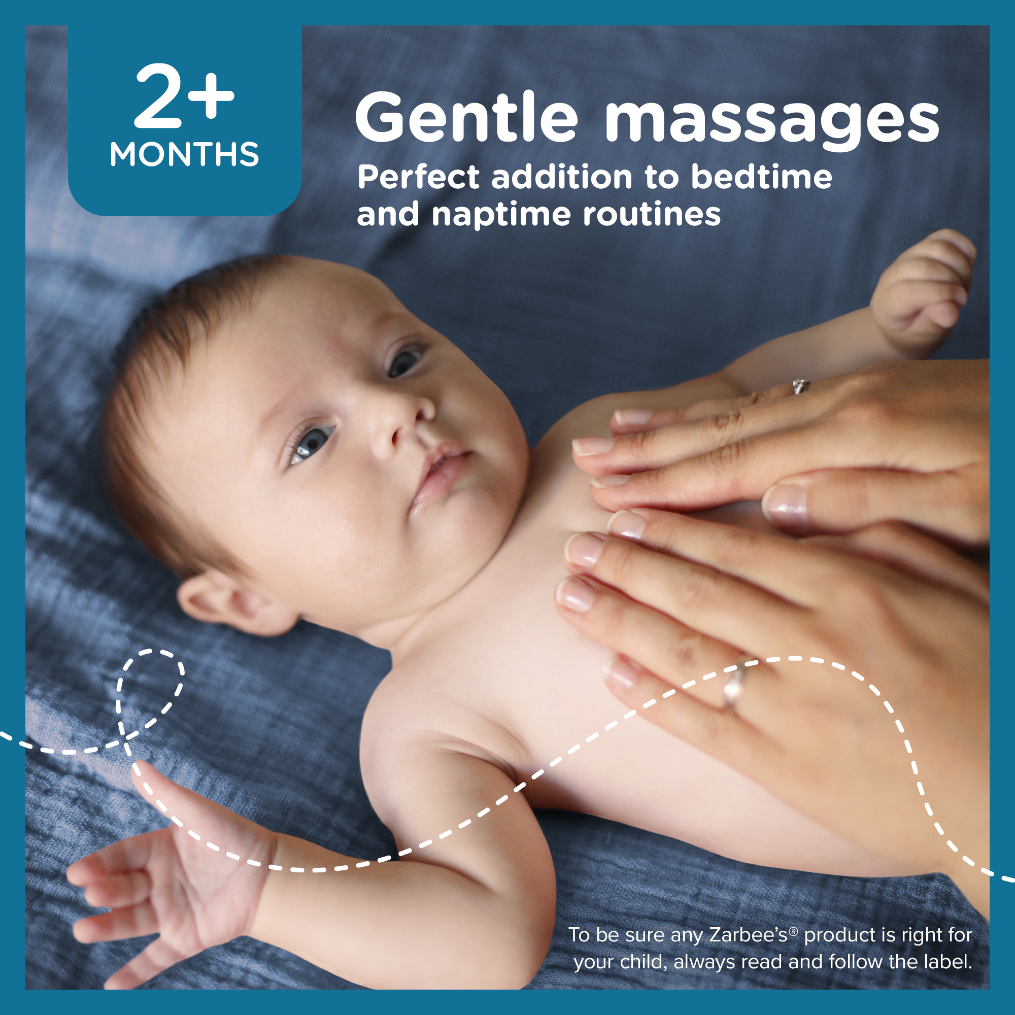 A baby is being gently massaged on the chest at bedtime