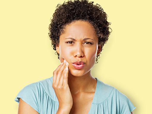 woman looking concerned about gum disease and gingivitis